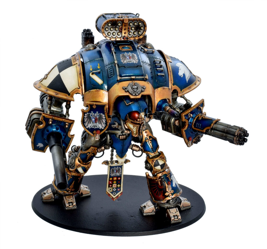 Blue painting model, with gold accenting, black and white shoulder plate.