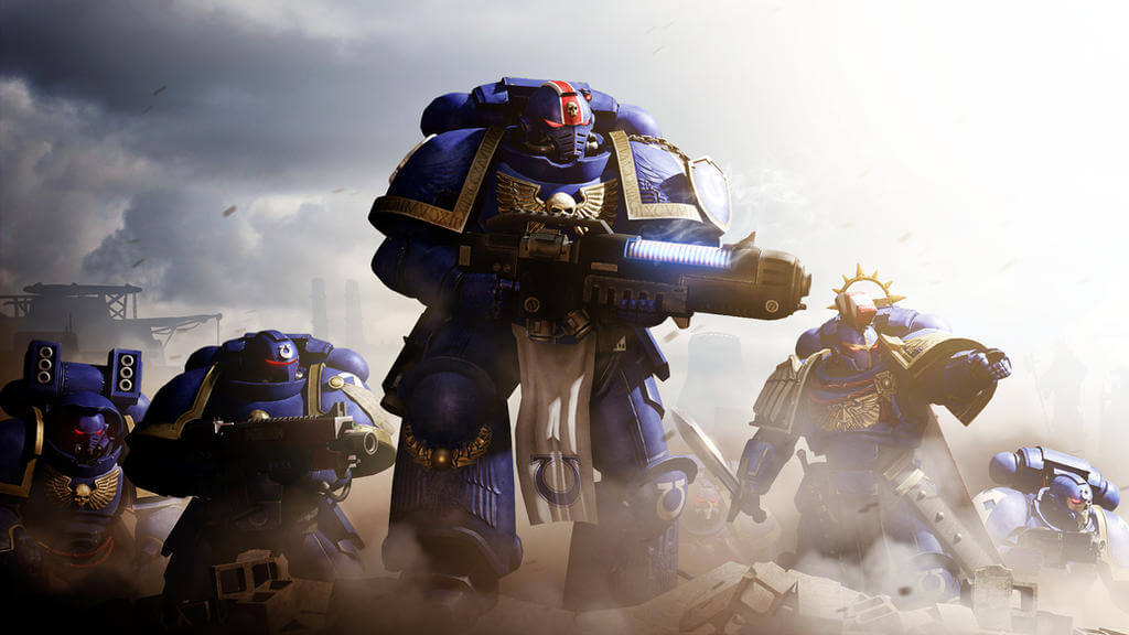 Primaris Space Marines in blue armor, led by a heavy weapon trooper on a smoky battlefield.